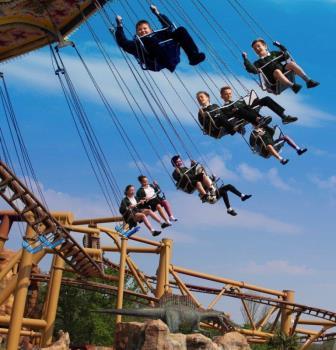 Children on Sky Swinger at Paultons Park.jpg